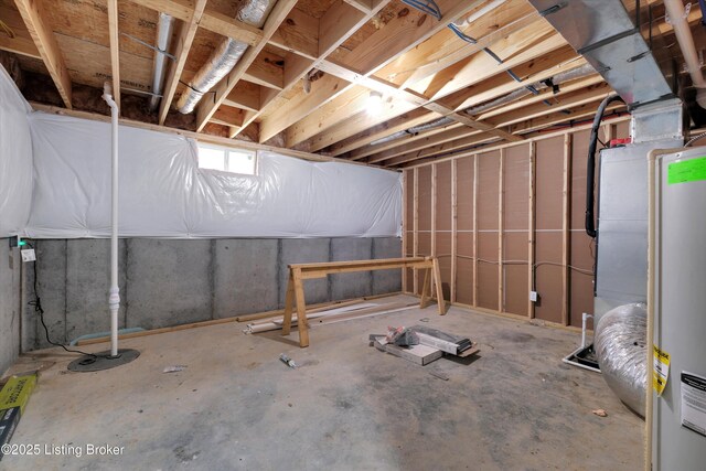 unfinished basement featuring water heater