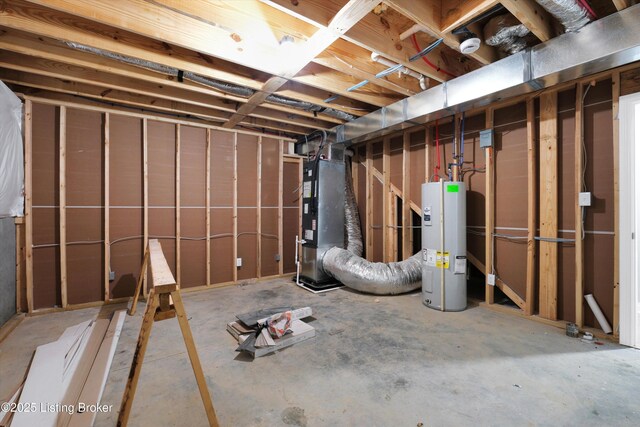 unfinished basement with heating unit and electric water heater