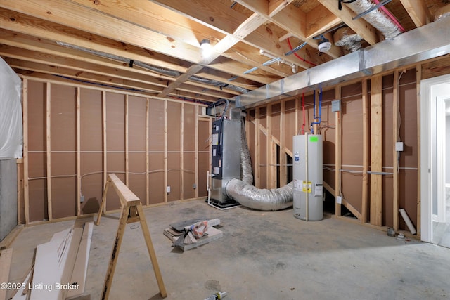 unfinished basement featuring heating unit and electric water heater