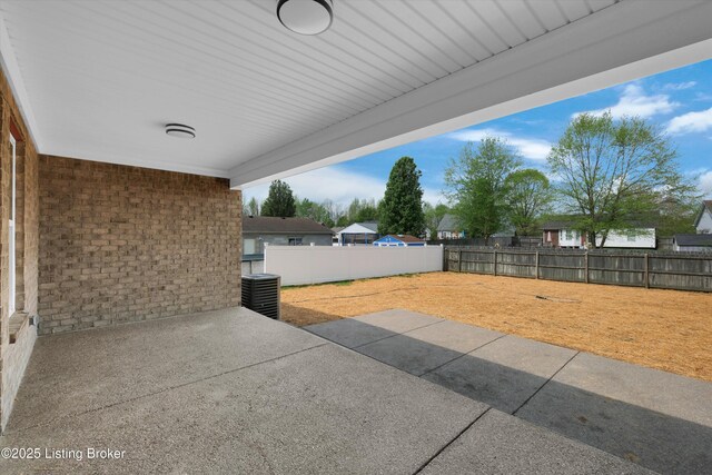 view of patio with a fenced backyard and central air condition unit