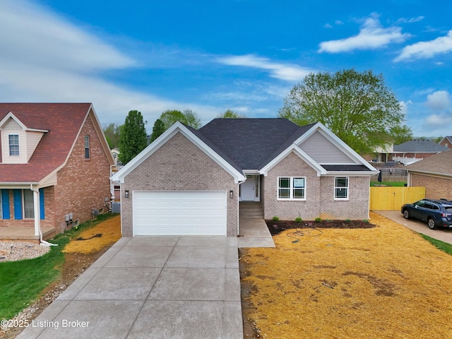 ranch-style house featuring driveway, an attached garage, fence, and brick siding