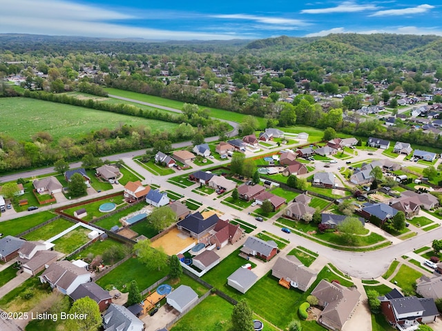 aerial view featuring a residential view and a forest view