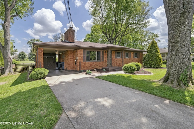 single story home with a front lawn, brick siding, a chimney, concrete driveway, and fence