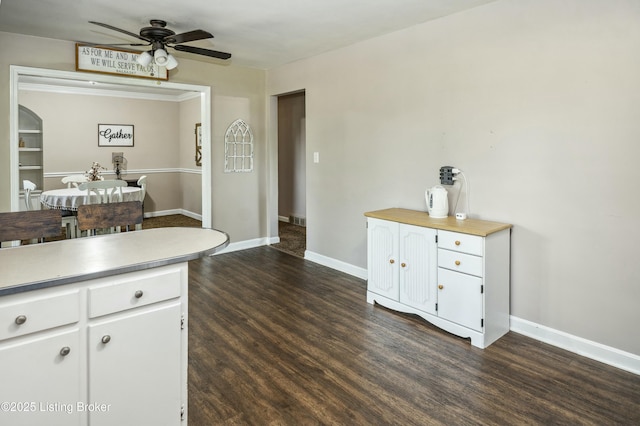 kitchen with white cabinets, a ceiling fan, and light countertops