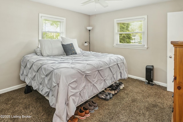 carpeted bedroom featuring baseboards and a ceiling fan