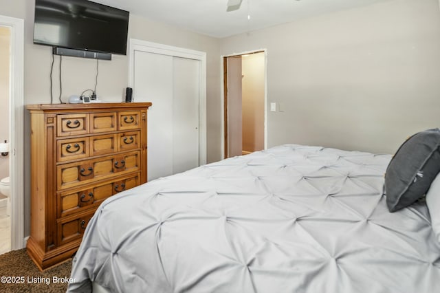 bedroom with a closet, ceiling fan, and carpet floors