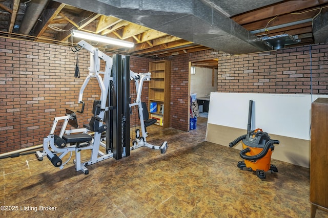 exercise area featuring brick wall