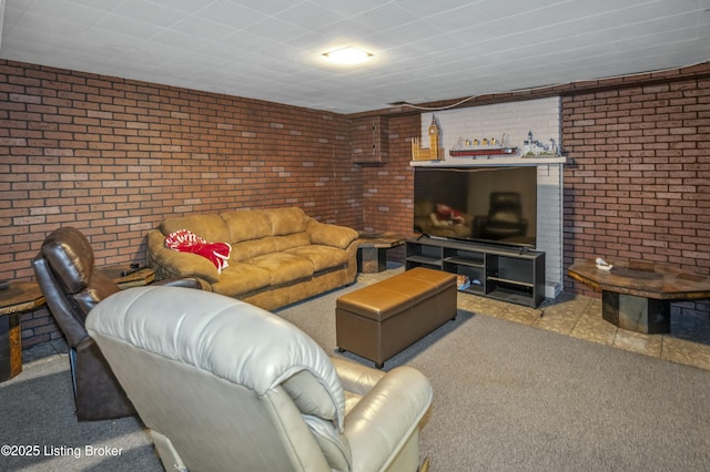 living room featuring carpet and brick wall
