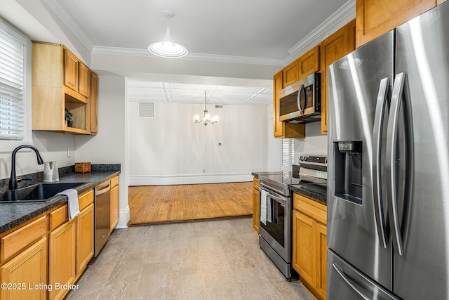 309 W Madison St, La Grange, KY 40031 - kitchen featuring appliances with stainless steel finishes, a sink, a chandelier, baseboards, and brown cabinets