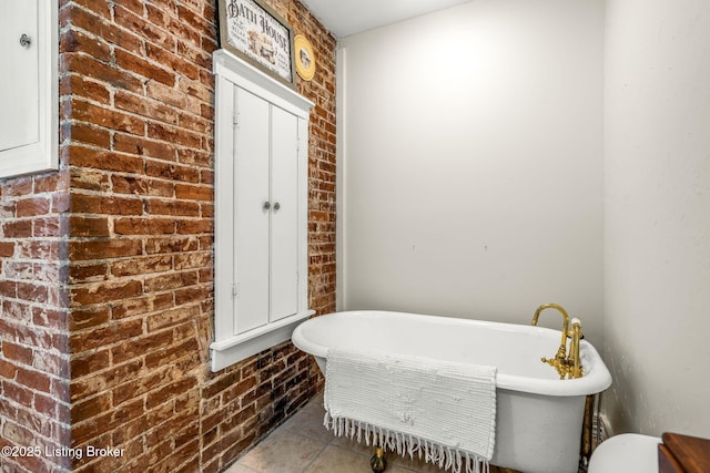 309 W Madison St, La Grange, KY 40031 - full bathroom featuring brick wall, a soaking tub, and tile patterned floors
