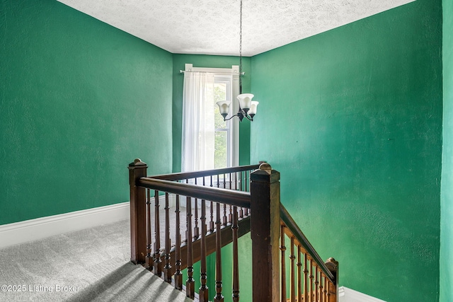 309 W Madison St, La Grange, KY 40031 - staircase with carpet floors, baseboards, a textured ceiling, a chandelier, and a textured wall