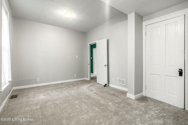 309 W Madison St, La Grange, KY 40031 - unfurnished bedroom featuring carpet floors, a textured ceiling, and baseboards