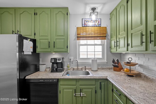 kitchen featuring green cabinetry, a sink, light countertops, freestanding refrigerator, and dishwasher