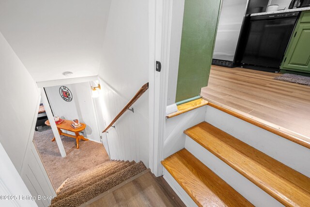 stairway with wood finished floors