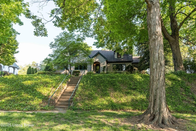 view of front of property featuring stairs