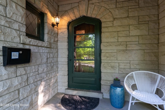 view of exterior entry with stone siding