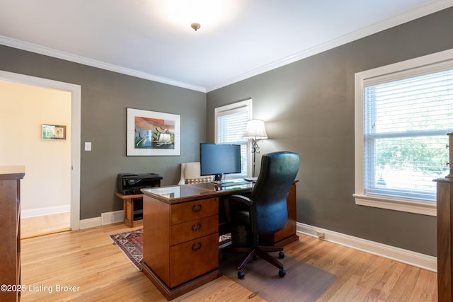 office area with plenty of natural light and light wood-style floors