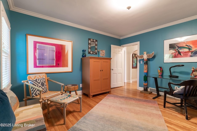 living area with light wood-style floors, crown molding, and baseboards