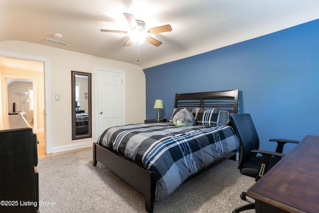 carpeted bedroom with visible vents, ceiling fan, and lofted ceiling