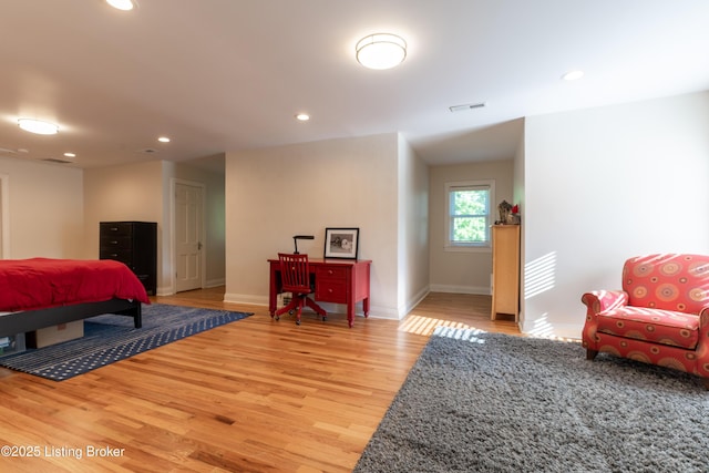 bedroom with recessed lighting, visible vents, baseboards, and light wood-type flooring