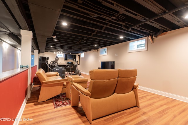 living room featuring baseboards and light wood finished floors