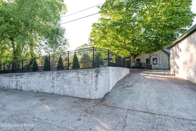 view of gate with fence