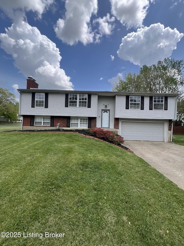 4213 Shenandoah Dr, Louisville, KY 40241 - split foyer home featuring driveway, a chimney, an attached garage, brick siding, and a front lawn
