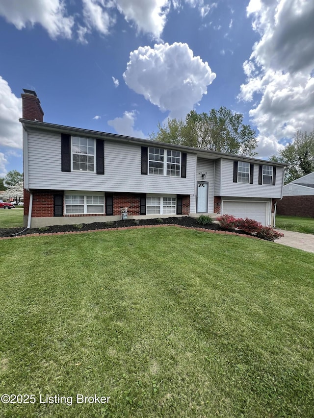 4213 Shenandoah Dr, Louisville, KY 40241 - raised ranch with a chimney, brick siding, a front yard, concrete driveway, and an attached garage
