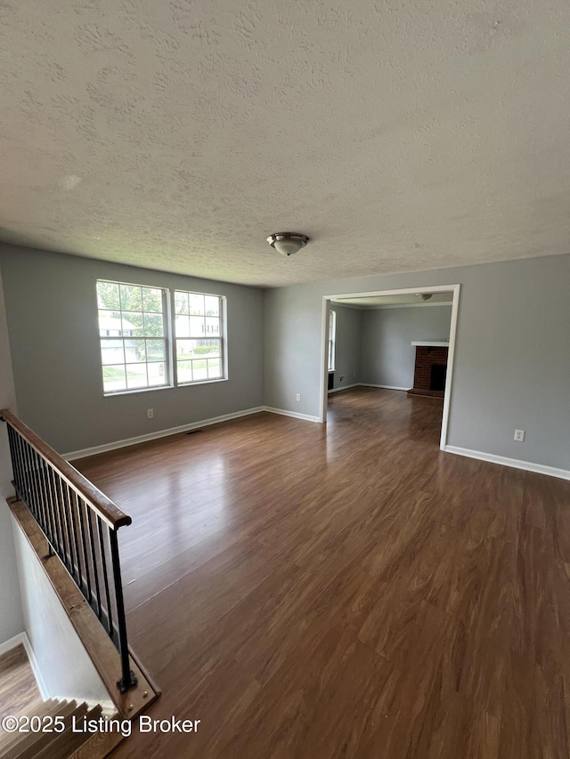 4213 Shenandoah Dr, Louisville, KY 40241 - unfurnished room with baseboards, a textured ceiling, and dark wood-type flooring