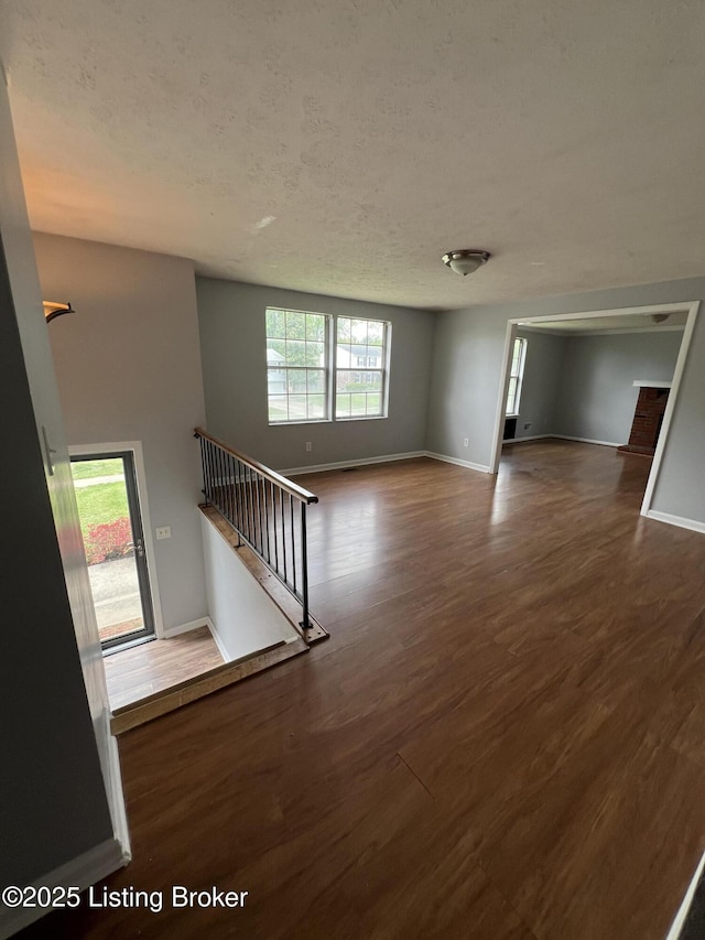 4213 Shenandoah Dr, Louisville, KY 40241 - interior space with a textured ceiling, wood finished floors, stairs, and baseboards