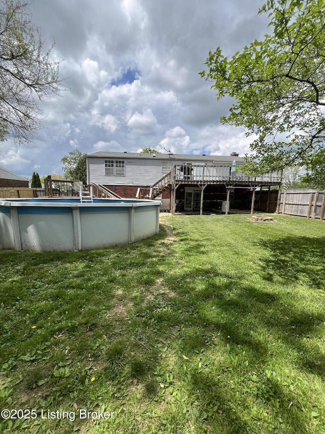 4213 Shenandoah Dr, Louisville, KY 40241 - view of yard with a wooden deck, an outdoor pool, stairway, and fence