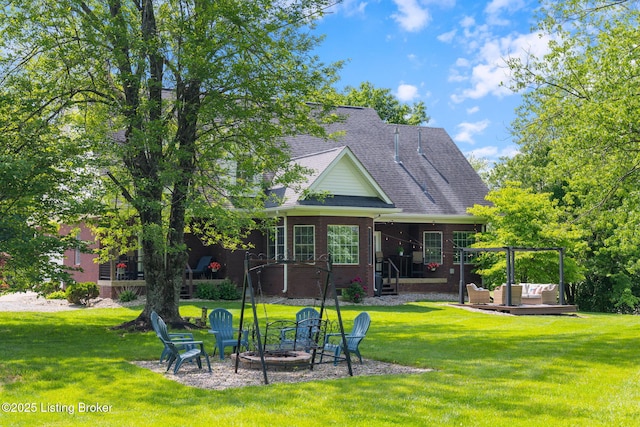 3817 Carriage Hill Dr, Crestwood, KY 40014 - back of house with brick siding, an outdoor living space with a fire pit, a patio area, and a yard