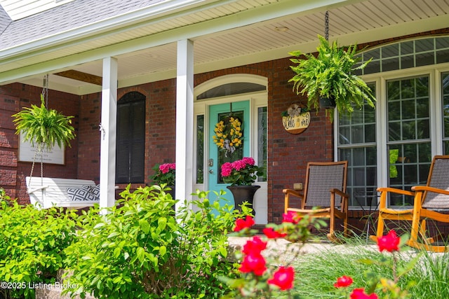 3817 Carriage Hill Dr, Crestwood, KY 40014 - view of exterior entry featuring brick siding, covered porch, and roof with shingles