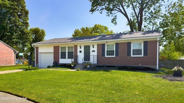 single story home with a garage, fence, a front yard, and brick siding