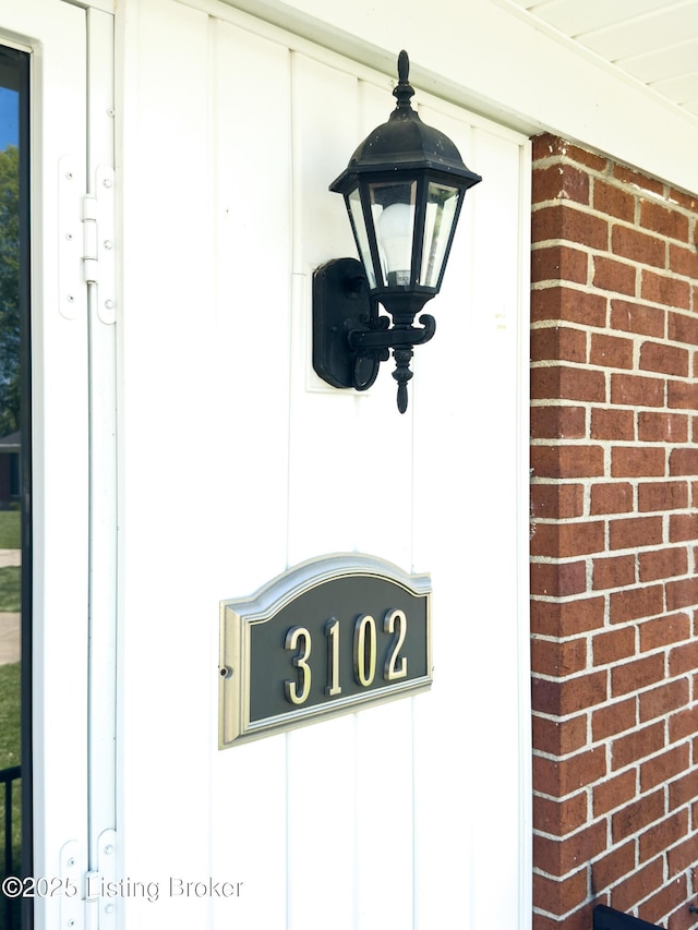 exterior details featuring brick siding