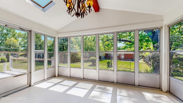 unfurnished sunroom with an inviting chandelier and vaulted ceiling with skylight
