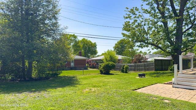 view of yard with a fenced backyard and a deck