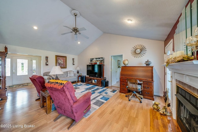 109 Terri Rose Ct, Hodgenville, KY 42748 - living area with light wood-type flooring, ceiling fan, a fireplace, and vaulted ceiling