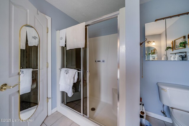 109 Terri Rose Ct, Hodgenville, KY 42748 - full bathroom with toilet, a shower stall, tile patterned flooring, and baseboards
