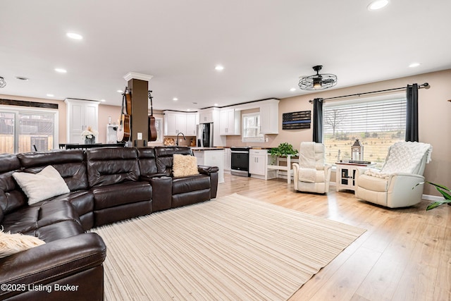living room featuring recessed lighting and light wood-style flooring