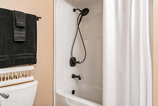 full bath with toilet and shower / bath combination with curtain