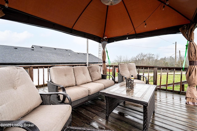 deck featuring an outdoor hangout area and a gazebo