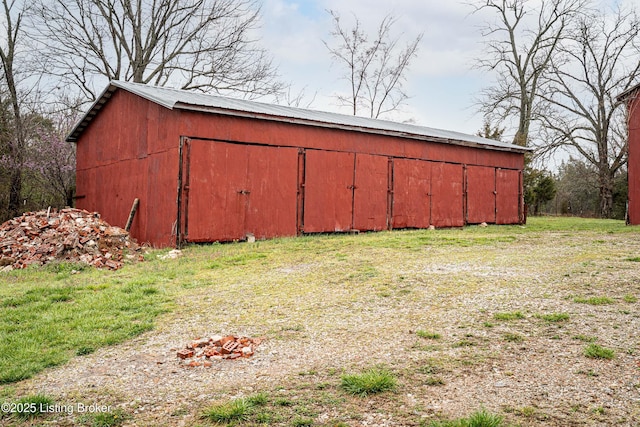 view of pole building with a lawn