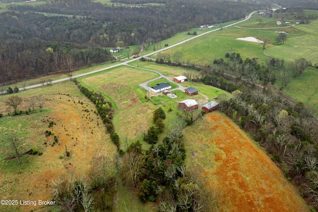 birds eye view of property with a rural view and a forest view