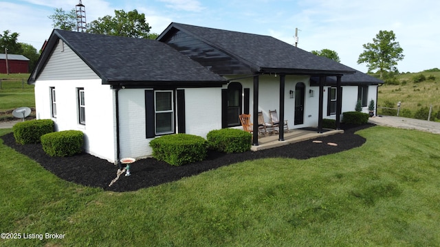 4200 Raywick Rd, Raywick, KY 40060 - view of front of home with a shingled roof, a porch, a front lawn, and brick siding