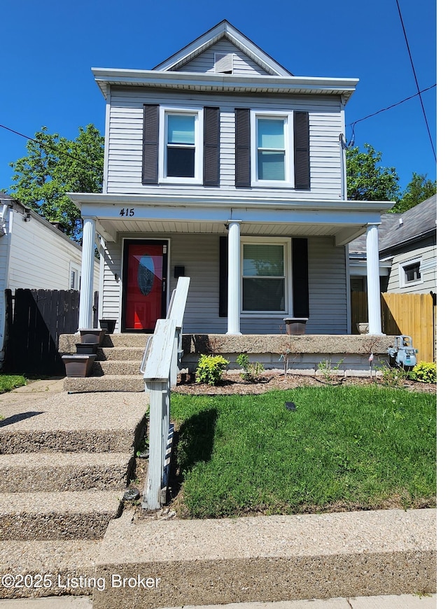 view of front of house with covered porch and fence