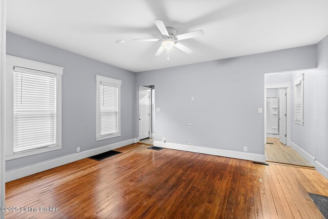 415 Gwendolyn St, Louisville, KY 40203 - unfurnished bedroom with hardwood / wood-style flooring, baseboards, and a ceiling fan