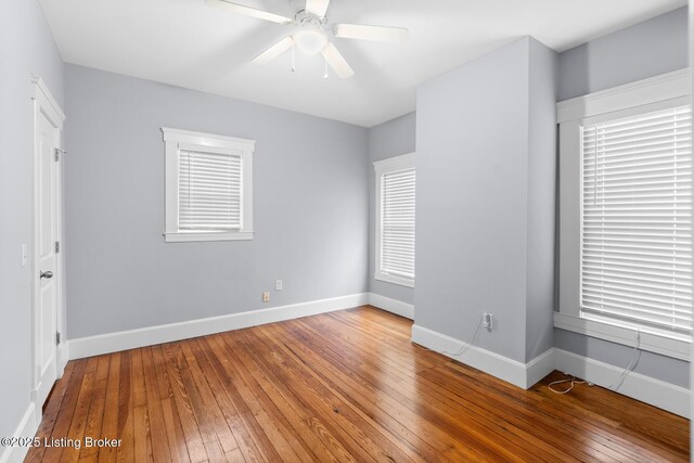 415 Gwendolyn St, Louisville, KY 40203 - unfurnished bedroom with hardwood / wood-style flooring, baseboards, and a ceiling fan
