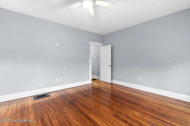 415 Gwendolyn St, Louisville, KY 40203 - spare room featuring baseboards, a ceiling fan, and hardwood / wood-style floors