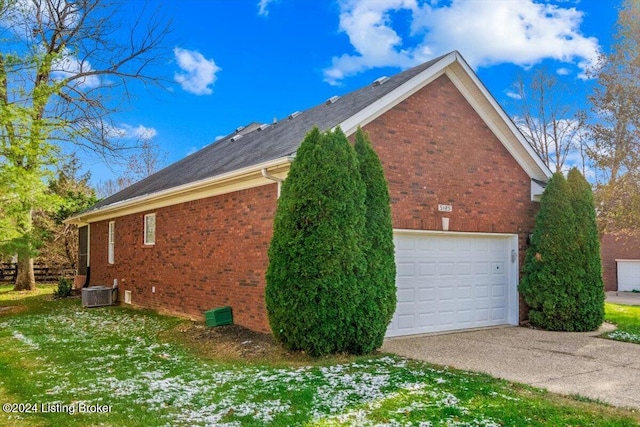 view of property exterior featuring a garage, brick siding, aphalt driveway, and cooling unit